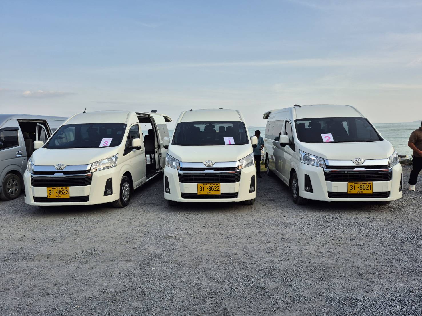 Theera Travel Toyota Commuter fleet by the sea